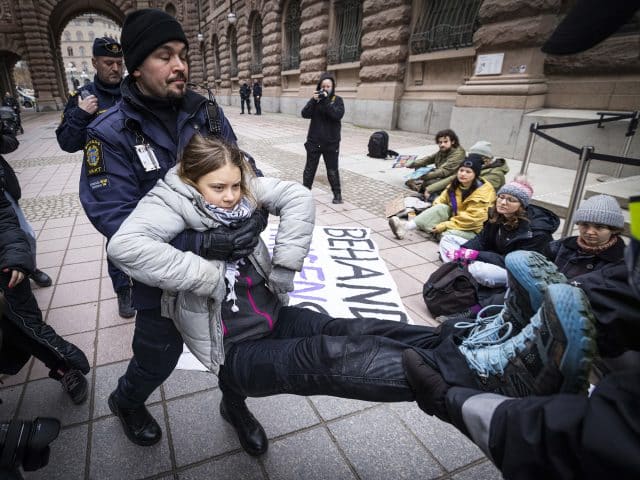 Greta Thunberg is arrested while protesting outside of the Swedish parliament. (News Photographer - Michael Campanella)